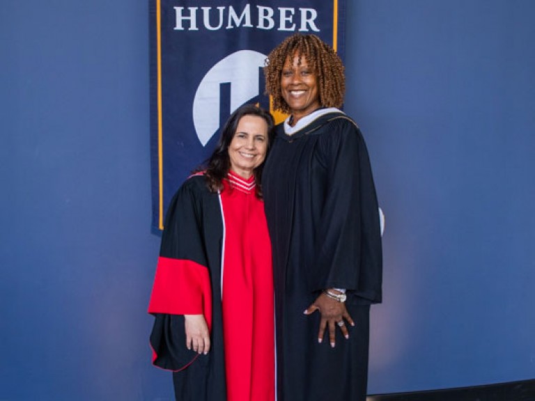 Jacqueline Edwards poses for photo with Humber faculty member