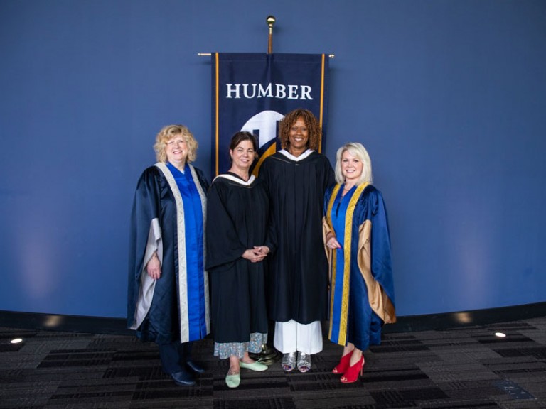 Jacqueline Edwards poses for photo with Humber president and two others