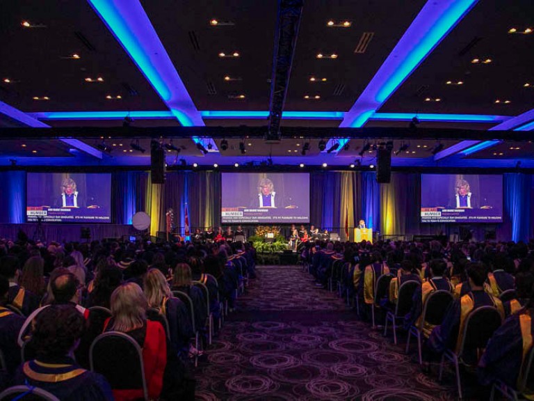 View of stage and audience from the rear of the ceremony hall