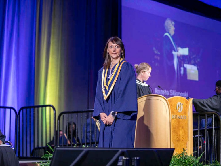 Graduate crossing the stage