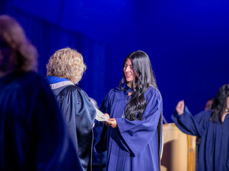 Graduate accepts certificate