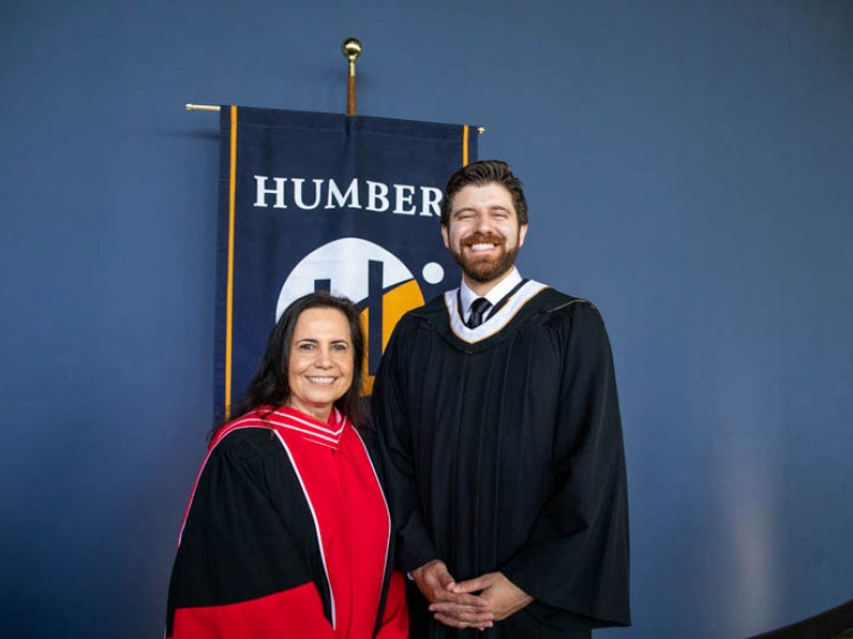 Honorary degree recipient Tareq Hadhad poses for photo with Humber faculty member