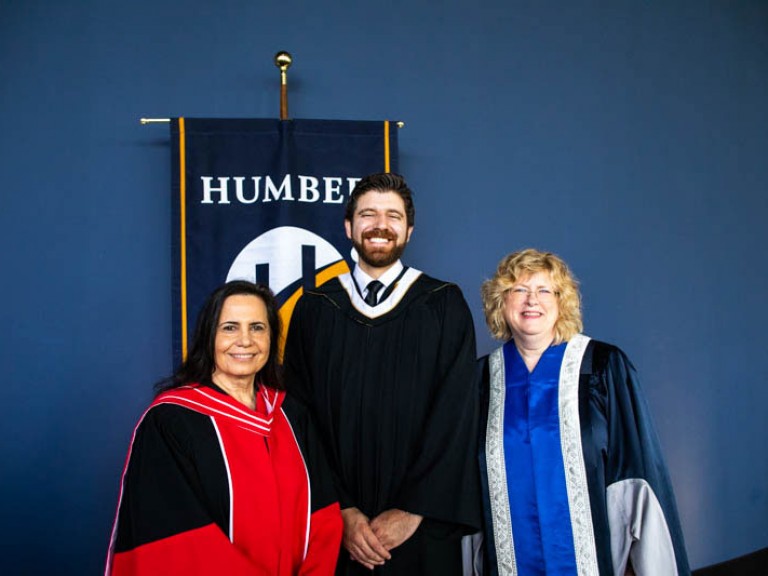 Honorary degree recipient Tareq Hadhad poses for photo with Humber faculty member and Humber president