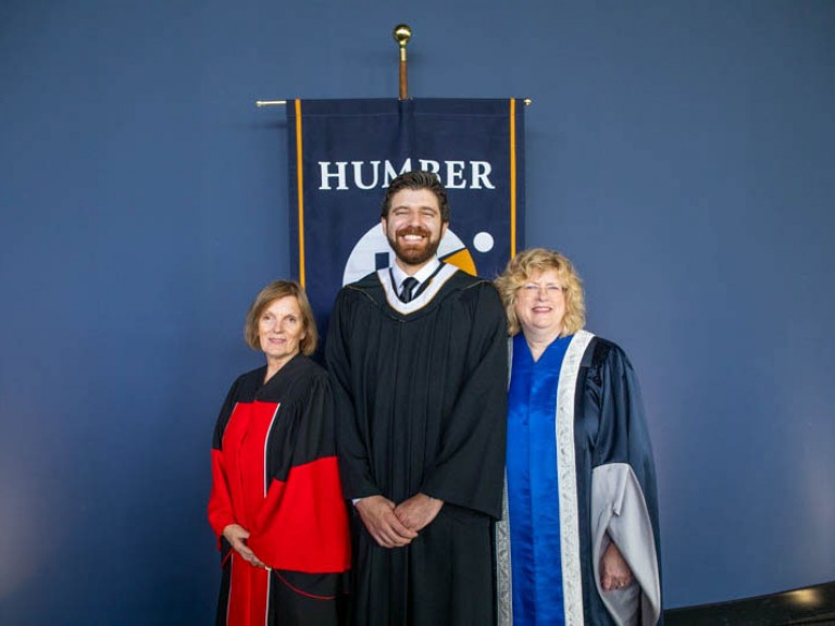 Honorary degree recipient Tareq Hadhad poses for photo with Humber faculty member and Humber president