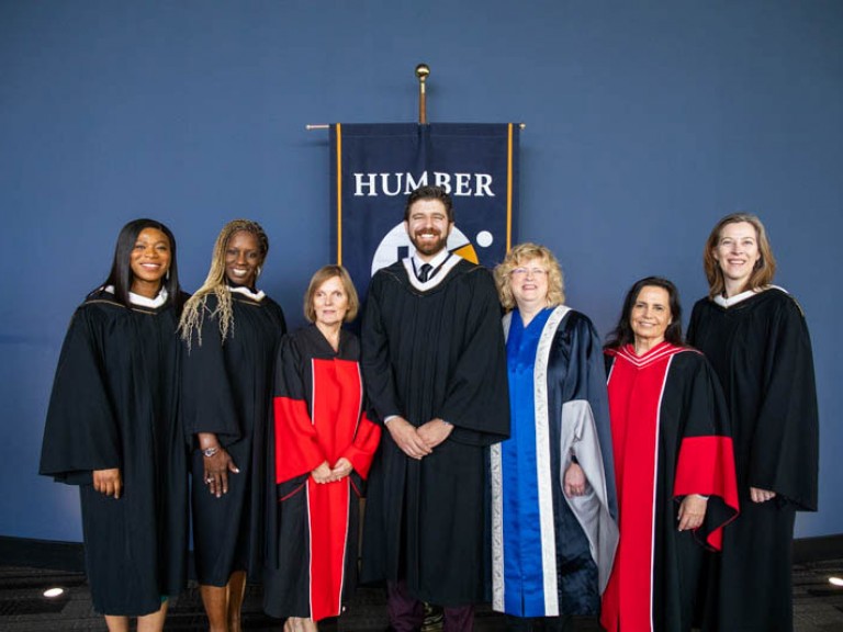 Honorary degree recipient Tareq Hadhad poses for photo with Humber faculty members