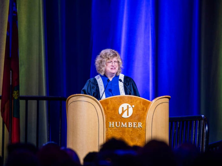 Humber president Ann Marie Vaughan speaking behind podium