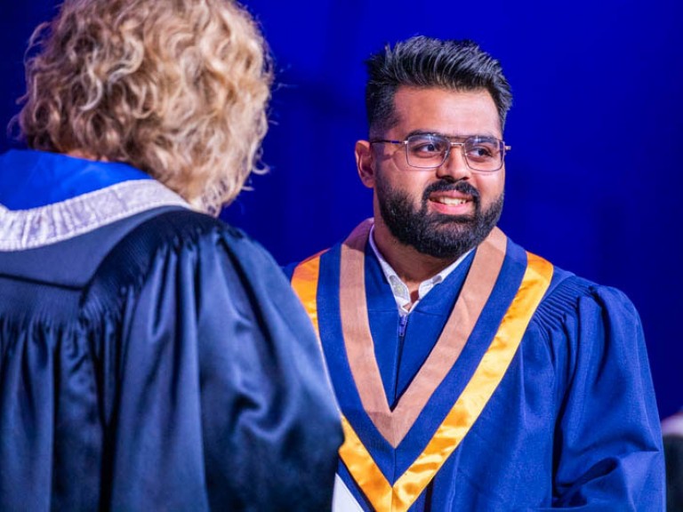 Graduate looks towards audience