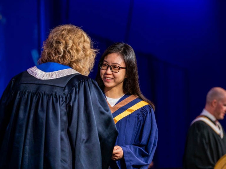 Graduate accepts certificate