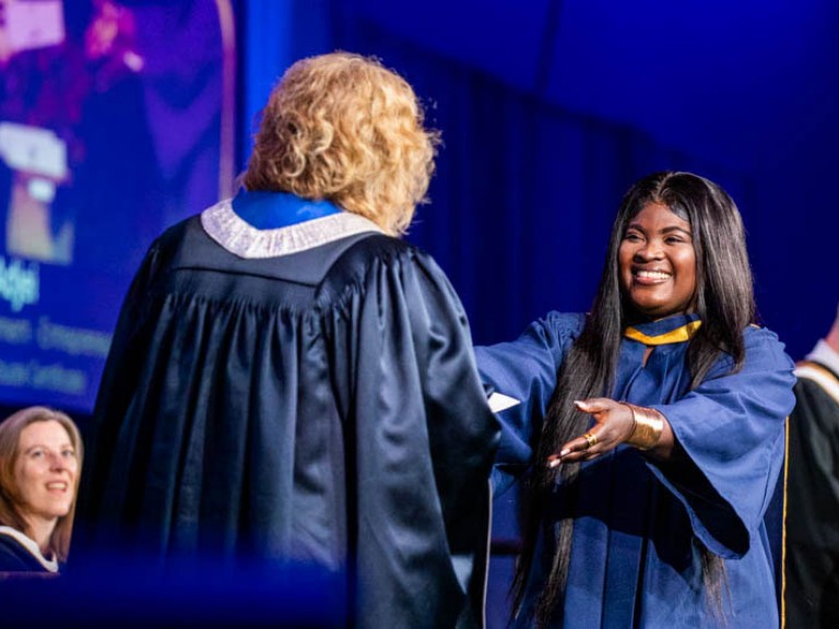 Graduate reaches out to receive their credential