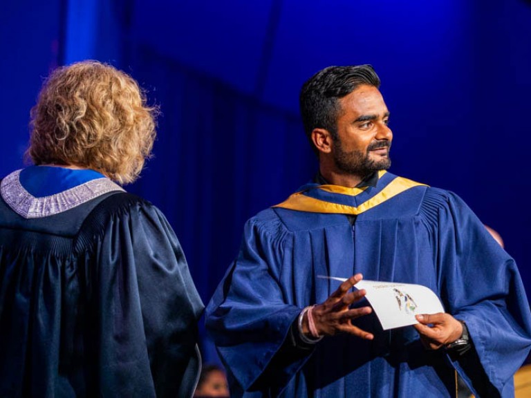 Graduate looks towards audience