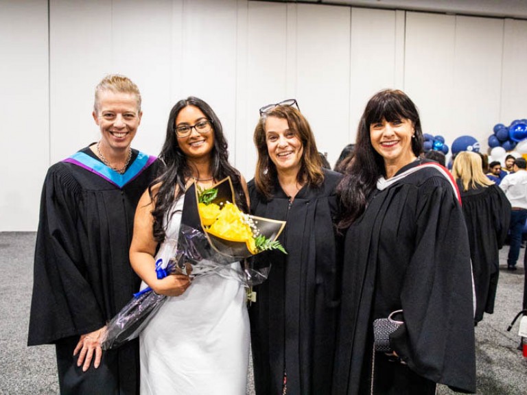 Four people pose for photo