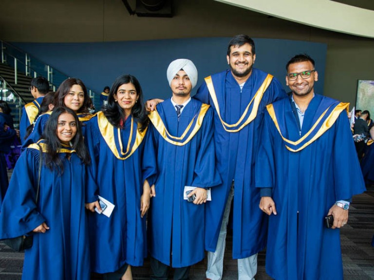 Six graduates take photo together