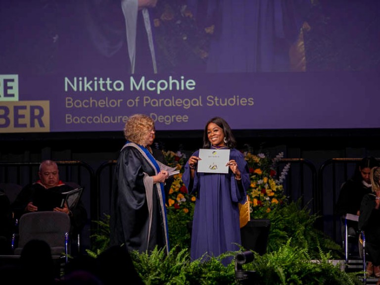 Graduate Nikitta Mcphie on stage