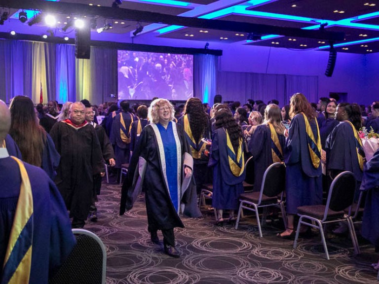 Humber president Ann Marie Vaughan proceeds down ceremony hall