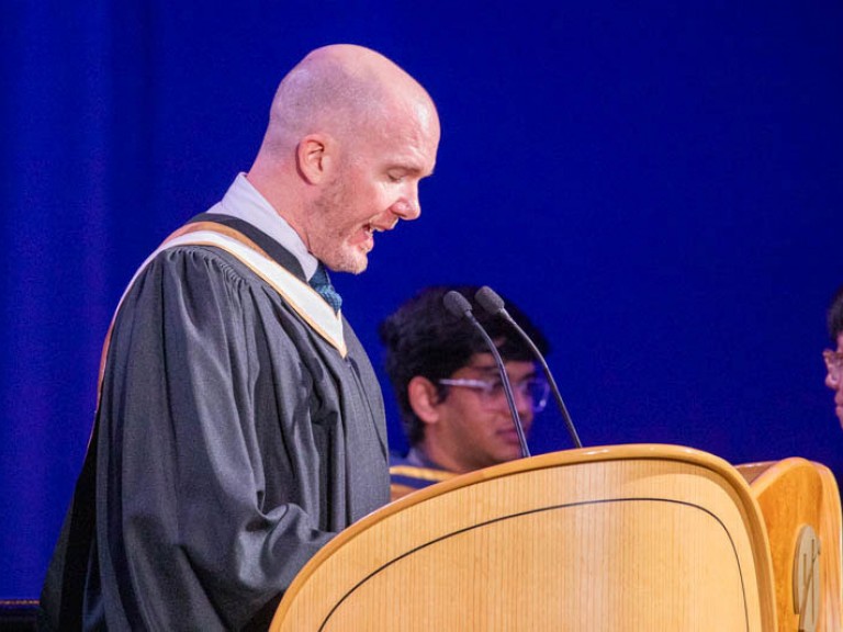 Person speaking behind podium