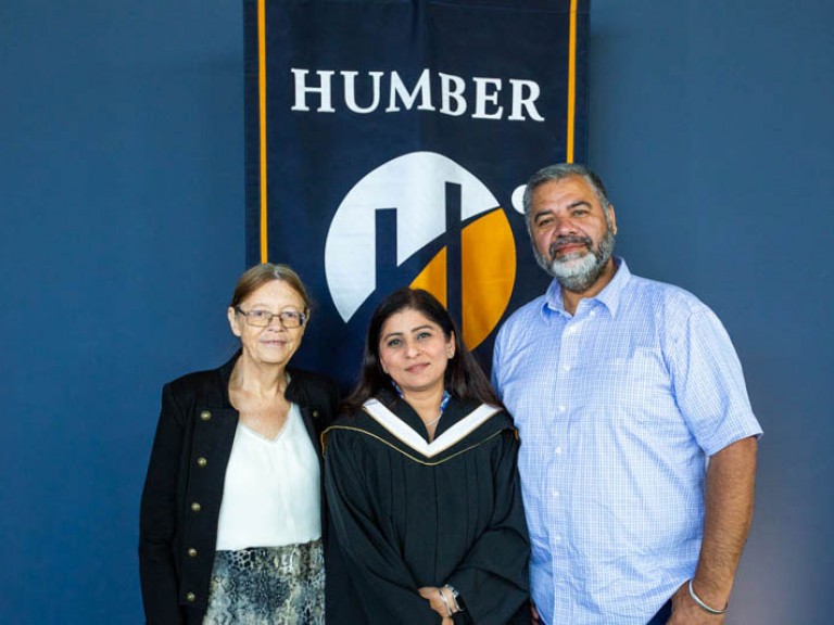 Honorary degree recipient Deepa Mattoo with two guests