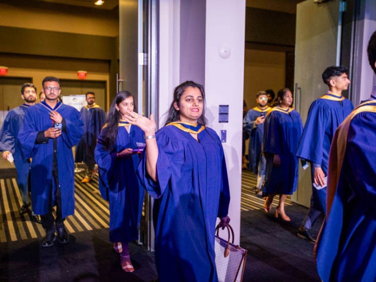 Humber graduates enter through doorway