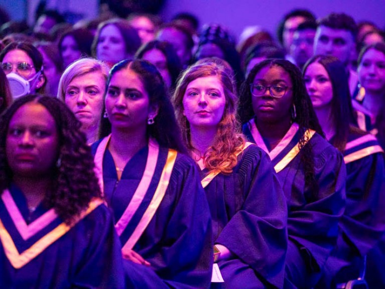 Graduates seated in ceremony hall