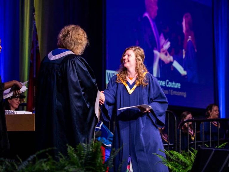 Graduate shakes Humber president's hand on stage