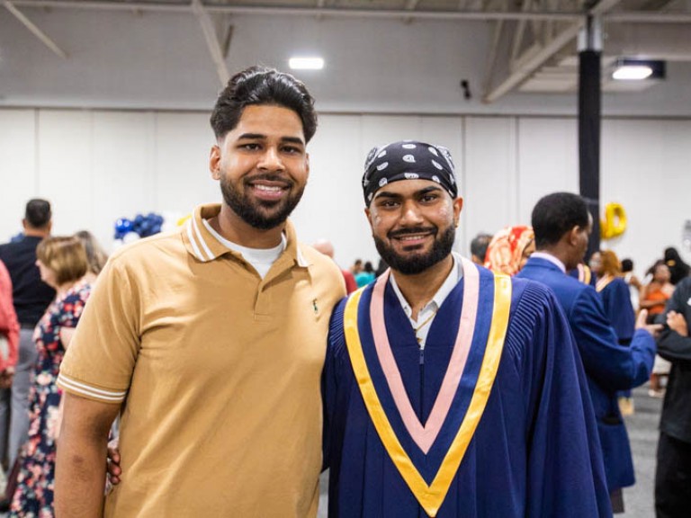 Graduate poses with guest