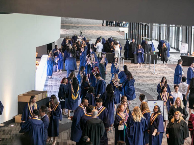 Graduates mingling in the reception area