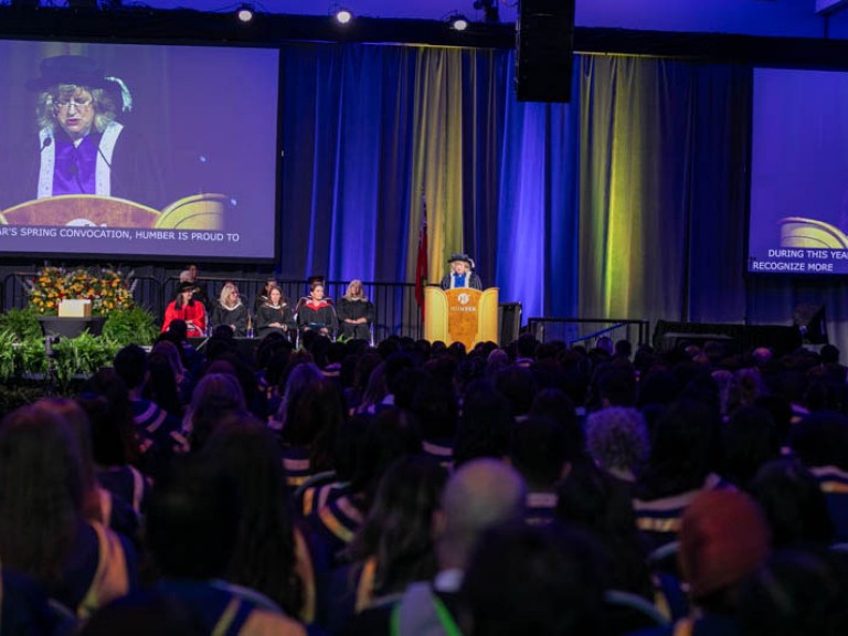 Humber president Ann Marie Vaughan stands behind the podium