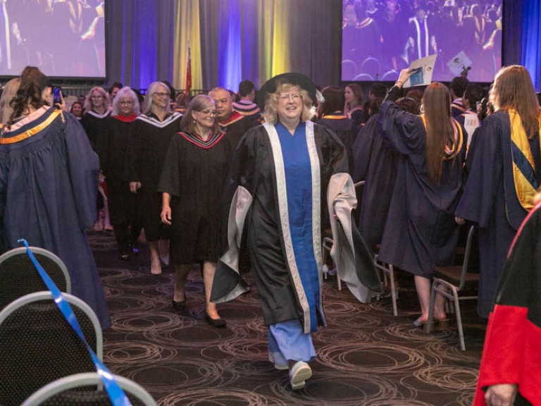 Humber faculty led by president Ann Marie Vaughan proceed down aisle