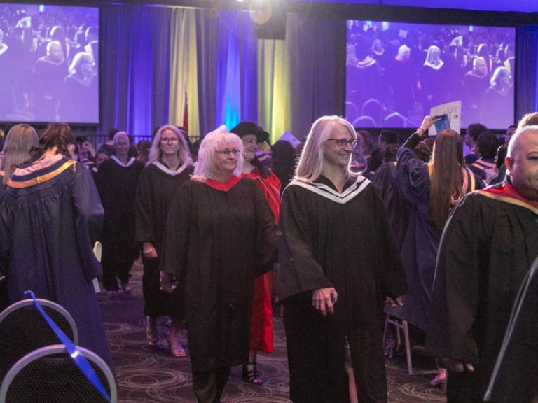 Humber faculty proceed down aisle