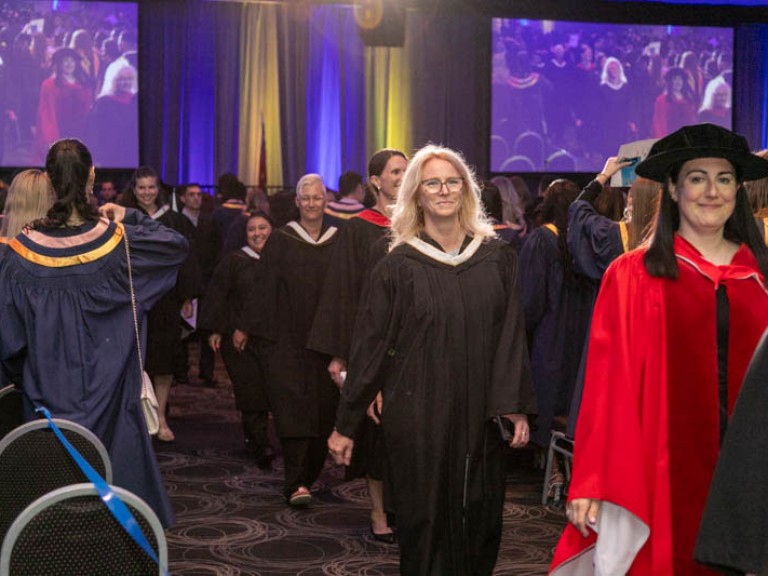 Humber faculty proceed down aisle