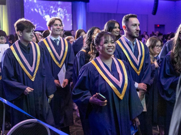 Graduates leave ceremony hall