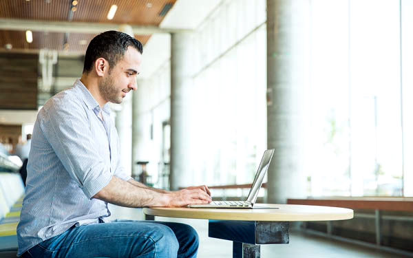 guy sitting at laptop