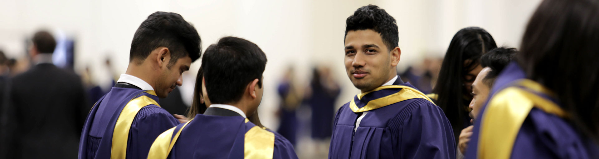 graduation student looking at camera