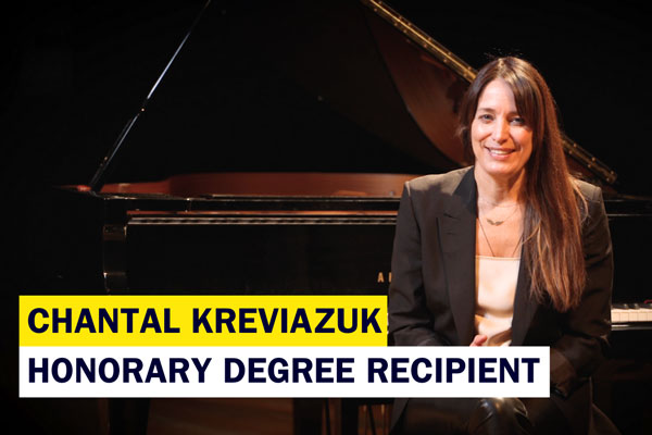 Chantal Kreviazuk sitting on piano bench