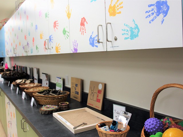 Baskets with some stuff on a shelf