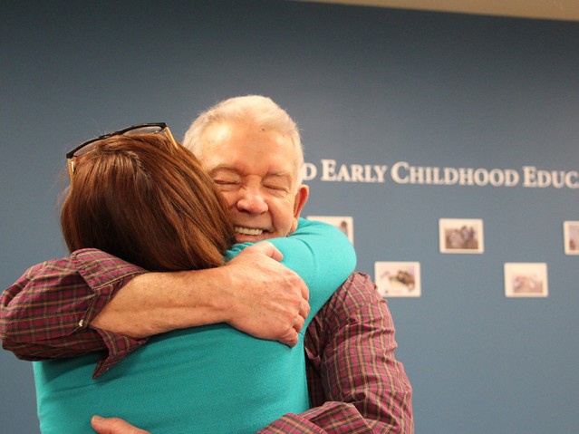 A man and women hugging each other