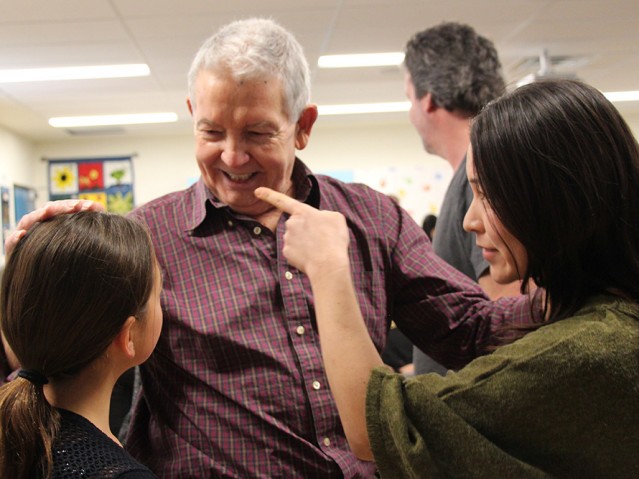 Small group of people talking and smiling