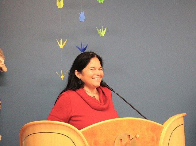 female speaker smiling