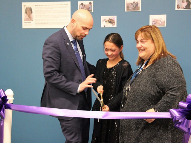 A girl cutting a ribbon