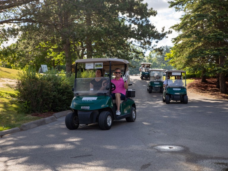 Golf carts driving past photographer