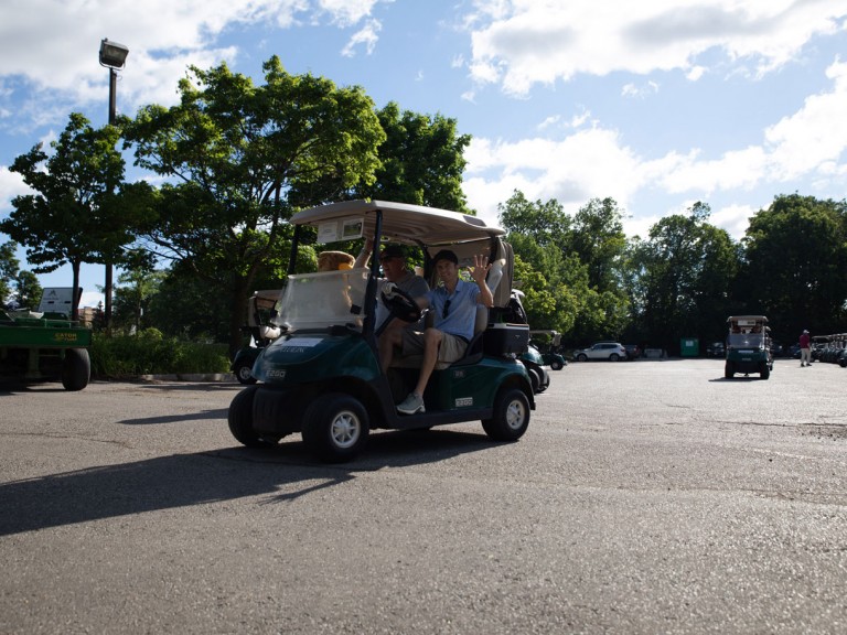 Golf cart leaving the lot