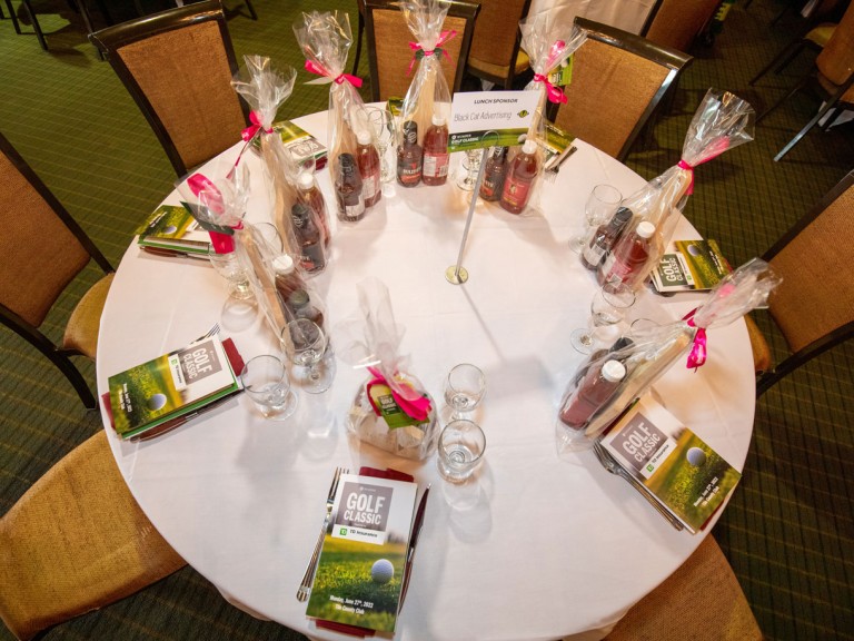 Overhead shot of dining table set up with dinnerware and Humber gifts