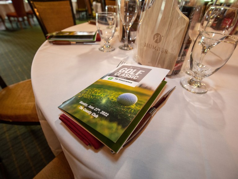 Brochure on napkin as table setting