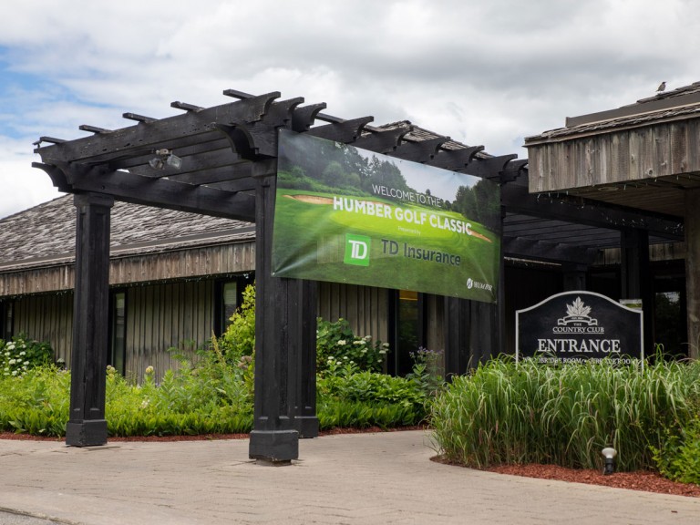 Country club entrance with Humber banner