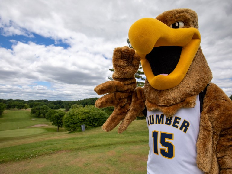Humber mascot with view of golf course behind them