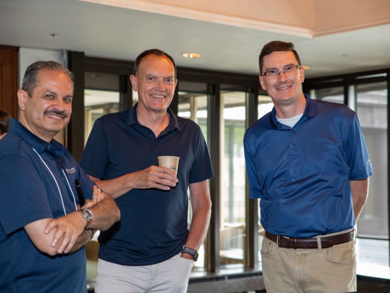 Two people smiling with former Humber president Chris Whitaker