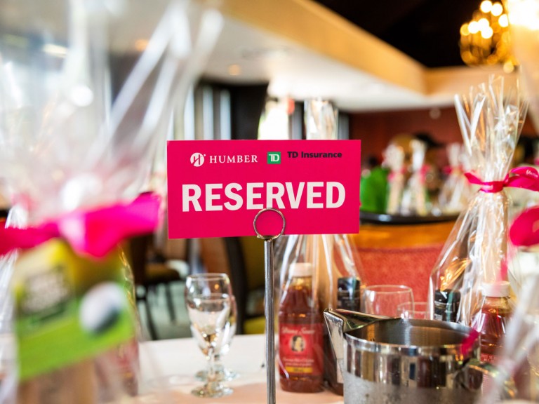 Sign on decorated table that reads: Humber TD Insurance Reserved