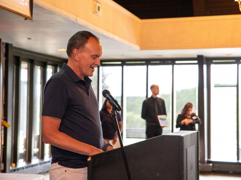Former Humber president Chris Whitaker stands behind podium