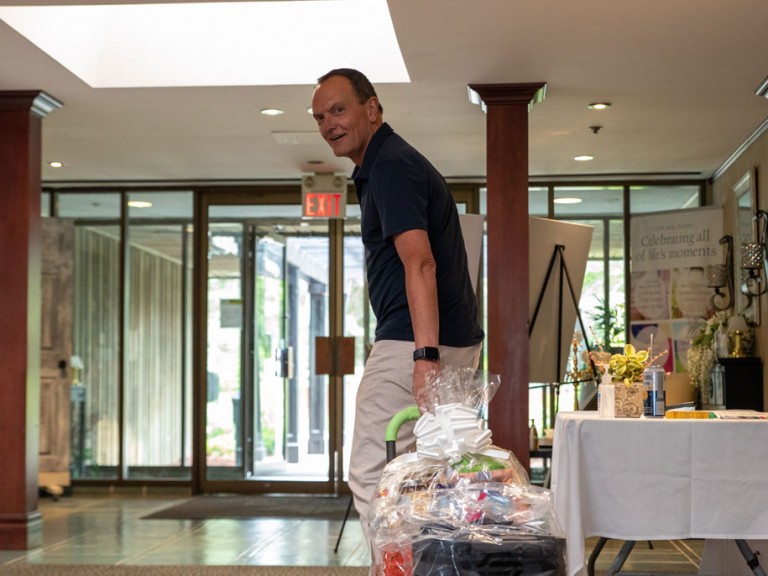 Former Humber president Christ Whitaker wheels trolley towards doors