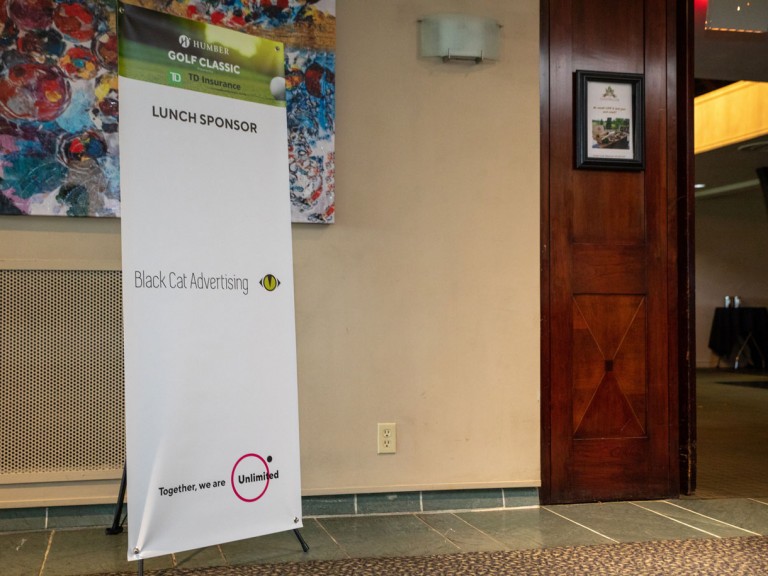 Banner that reads: Lunch sponsor Black Cat Advertising