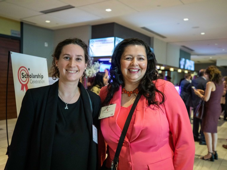 Two women smiling for camera